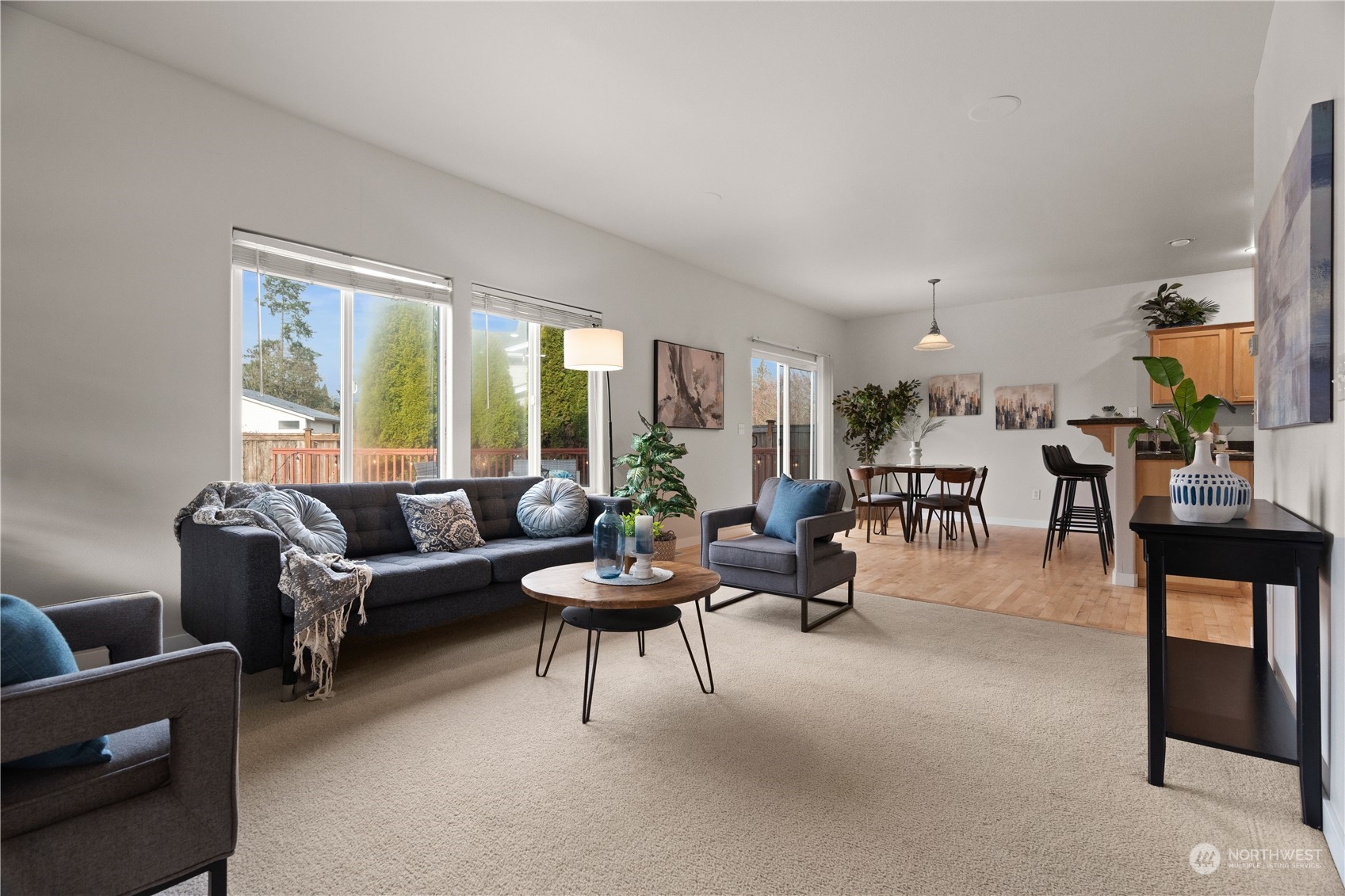 1012 186th Street Southeast Bothell, WA 98012 - Photo 10 of 40 a living room with furniture and a large window