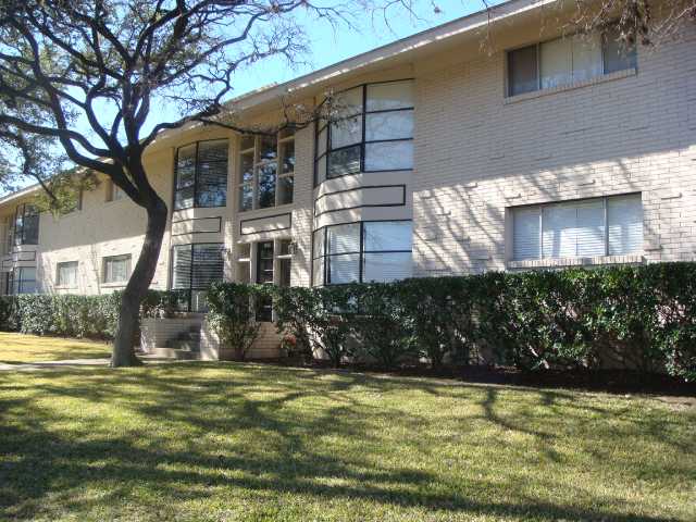1210 Windsor Road, Unit 101 Austin, TX 78703 - Photo 1 of 1 a front view of a house with a yard
