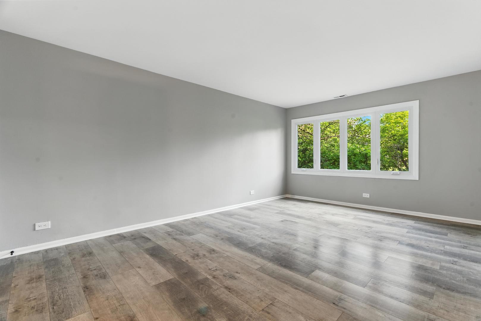 1415 Chartres Drive, Unit 1F Northbrook, IL 60062 - Photo 17 of 35 a view of an empty room with a window