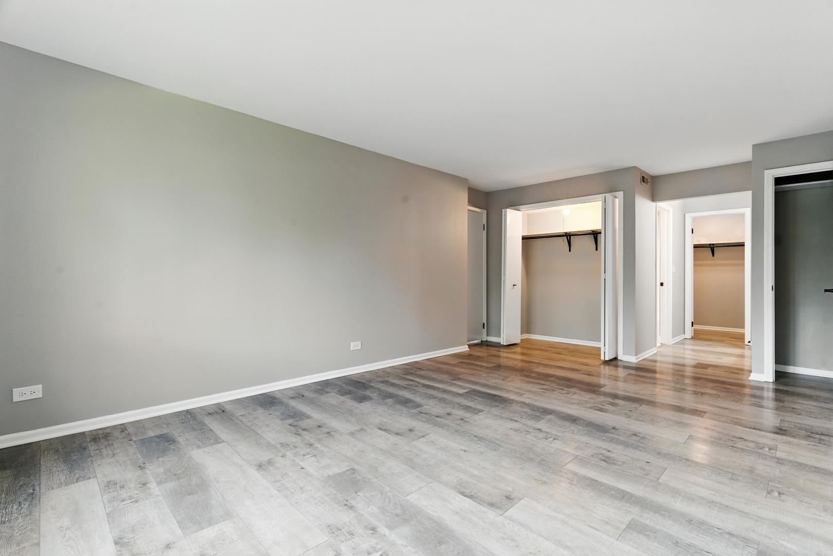 1415 Chartres Drive, Unit 1F Northbrook, IL 60062 - Photo 18 of 35 a view of an empty room and wooden floor
