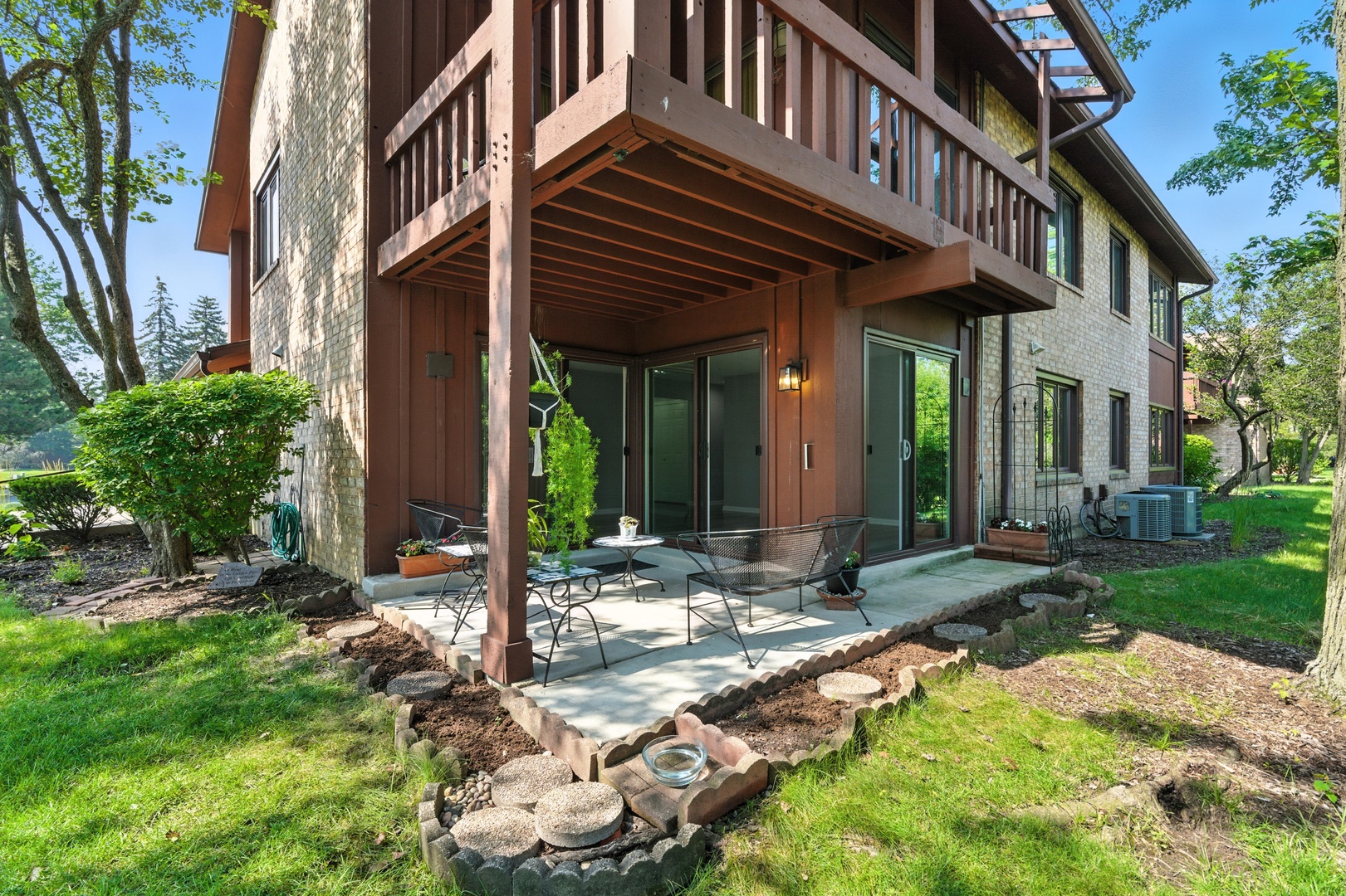 1415 Chartres Drive, Unit 1F Northbrook, IL 60062 - Photo 24 of 35 a view of a house with backyard porch and sitting area