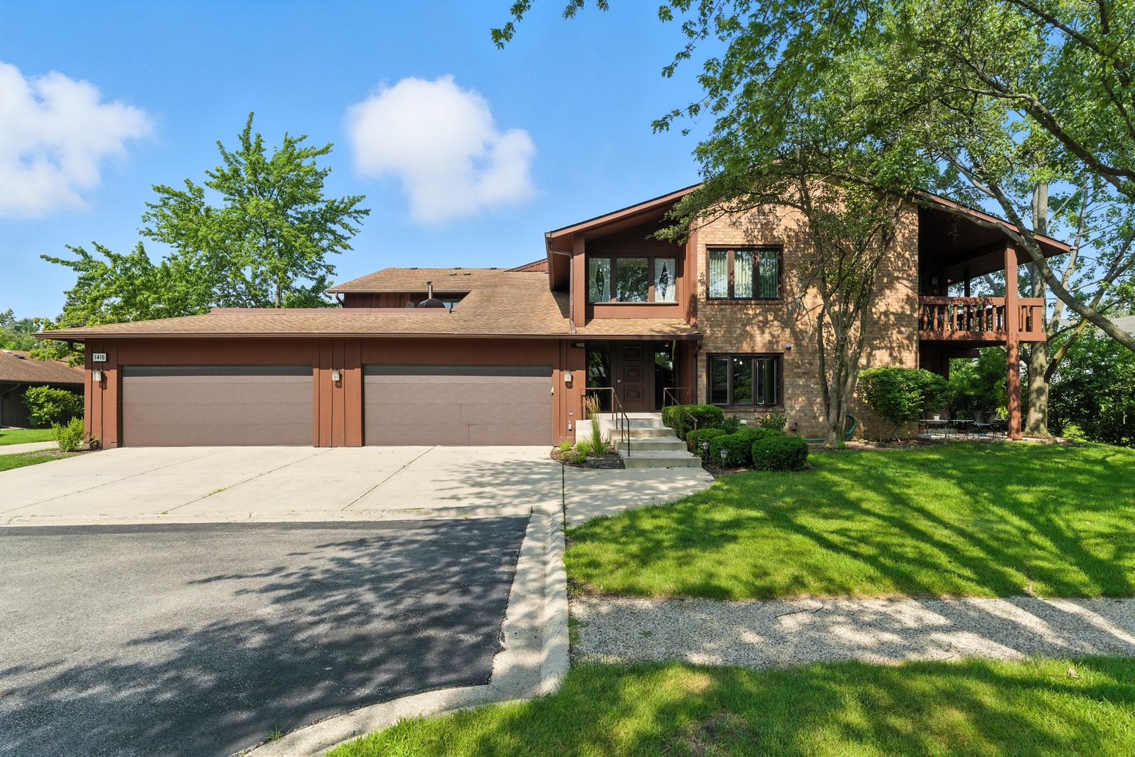 1415 Chartres Drive, Unit 1F Northbrook, IL 60062 - Photo 35 of 35 a front view of a house with a yard and garage