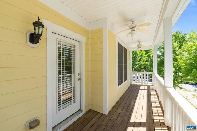 a view of balcony with wooden floor