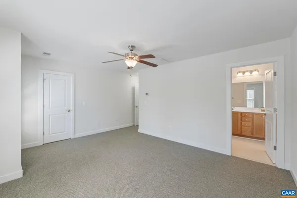 a bathroom with a double vanity sink and mirror with shower