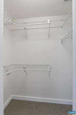 a view of a hallway with washer and dryer