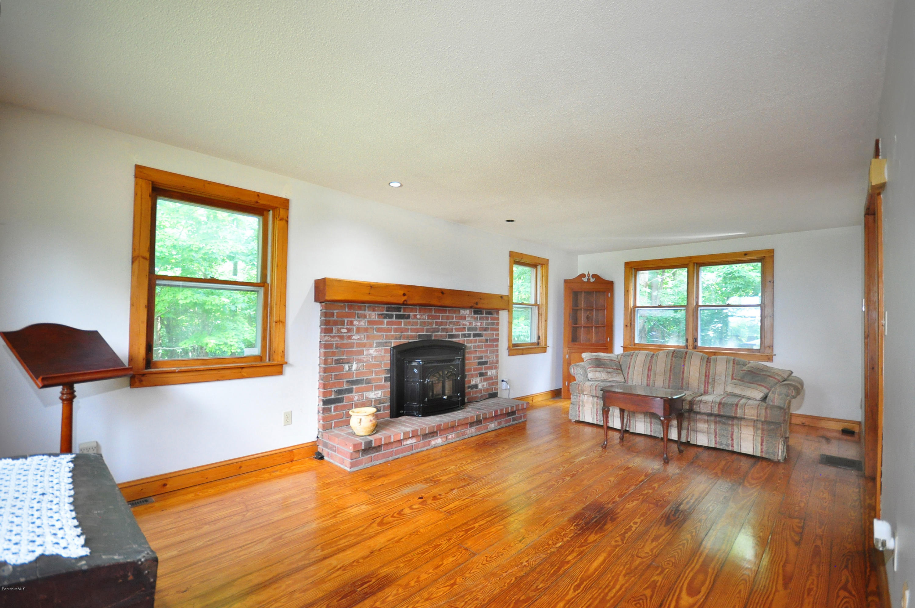 6 Johnnycake Hill Road Chester, MA 01011 - Photo 12 of 43 a living room with furniture and a fireplace