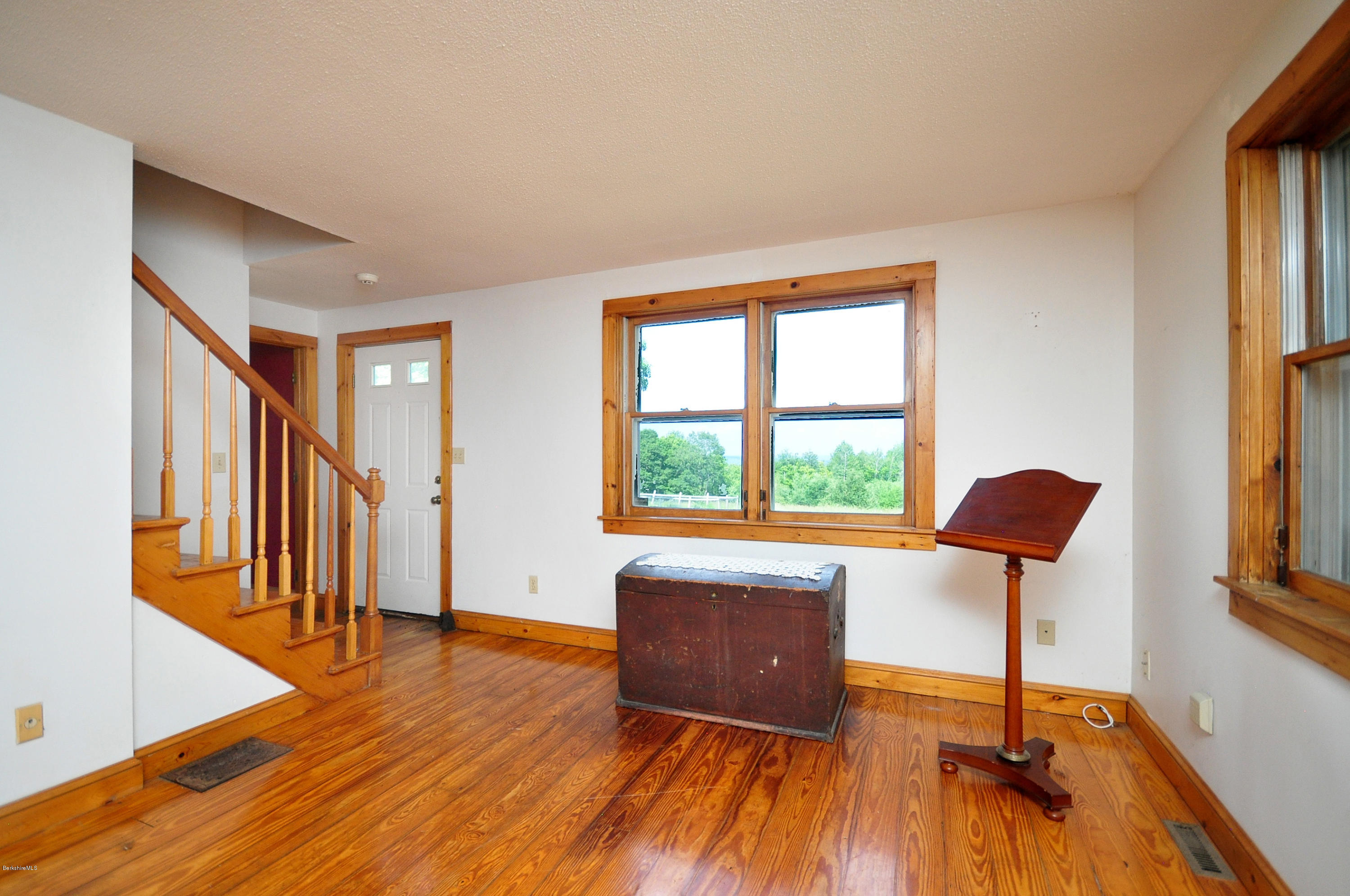 6 Johnnycake Hill Road Chester, MA 01011 - Photo 15 of 43 a view of an empty room with window and wooden floor