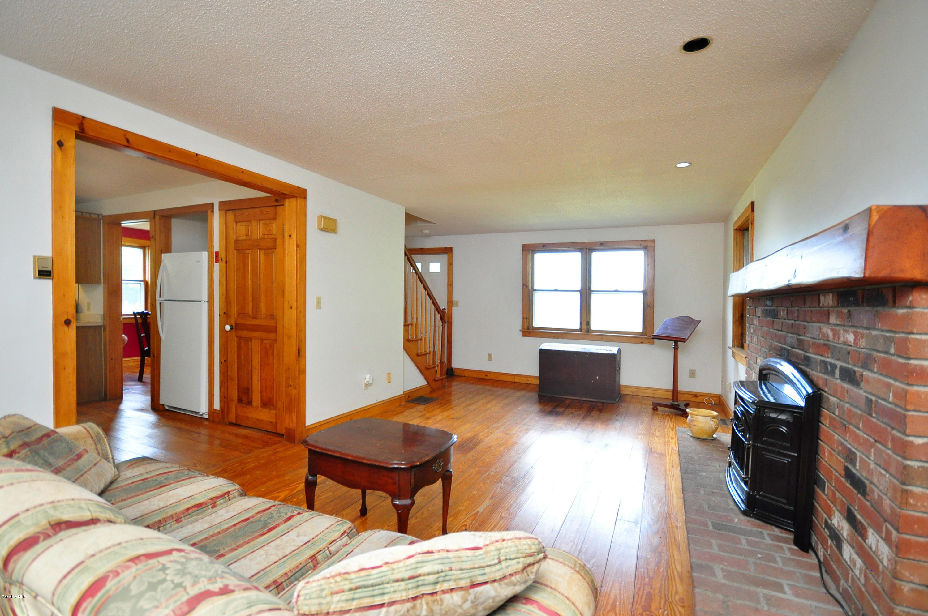 6 Johnnycake Hill Road Chester, MA 01011 - Photo 16 of 43 a bedroom with furniture and a fireplace