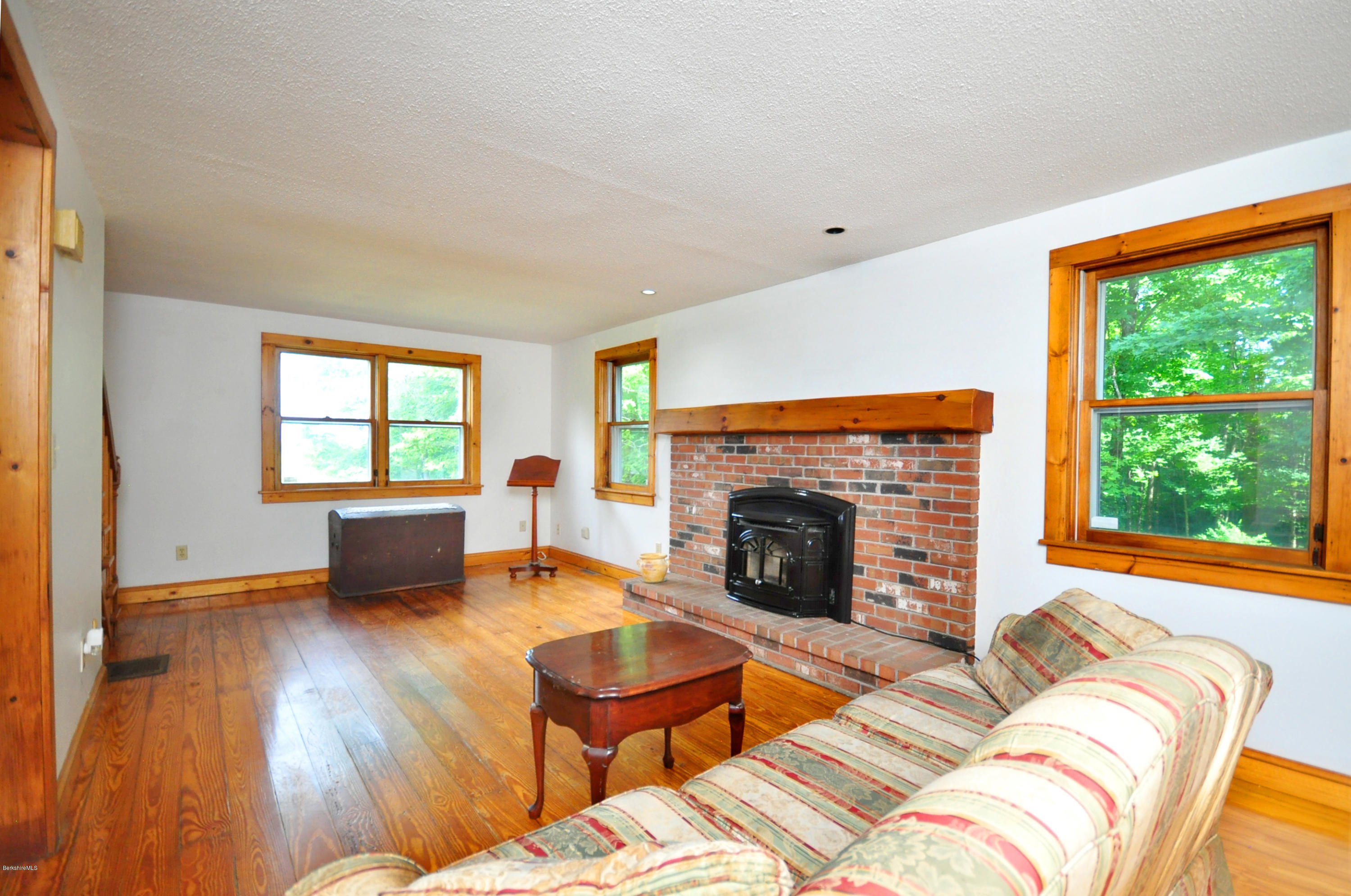 6 Johnnycake Hill Road Chester, MA 01011 - Photo 17 of 43 a living room with furniture and a fireplace