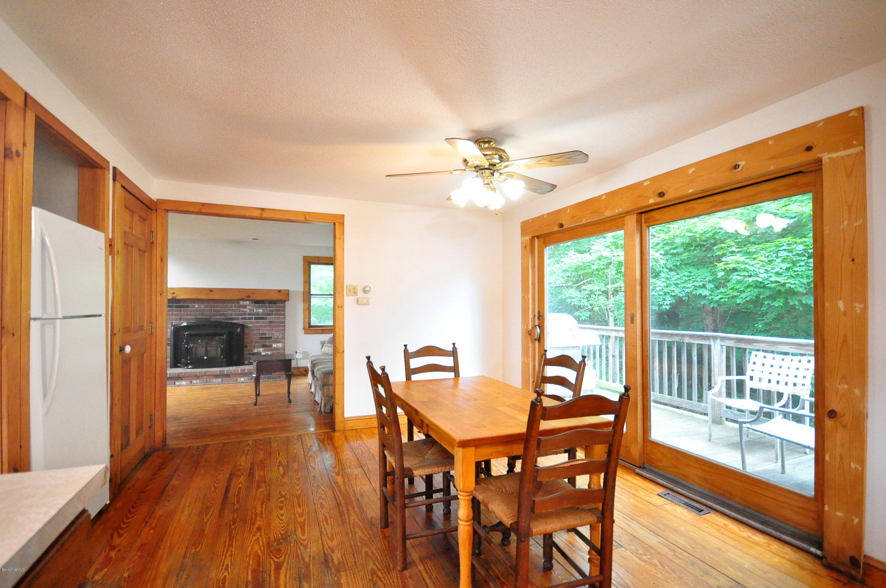6 Johnnycake Hill Road Chester, MA 01011 - Photo 18 of 43 a view of a dining room with furniture window and wooden floor