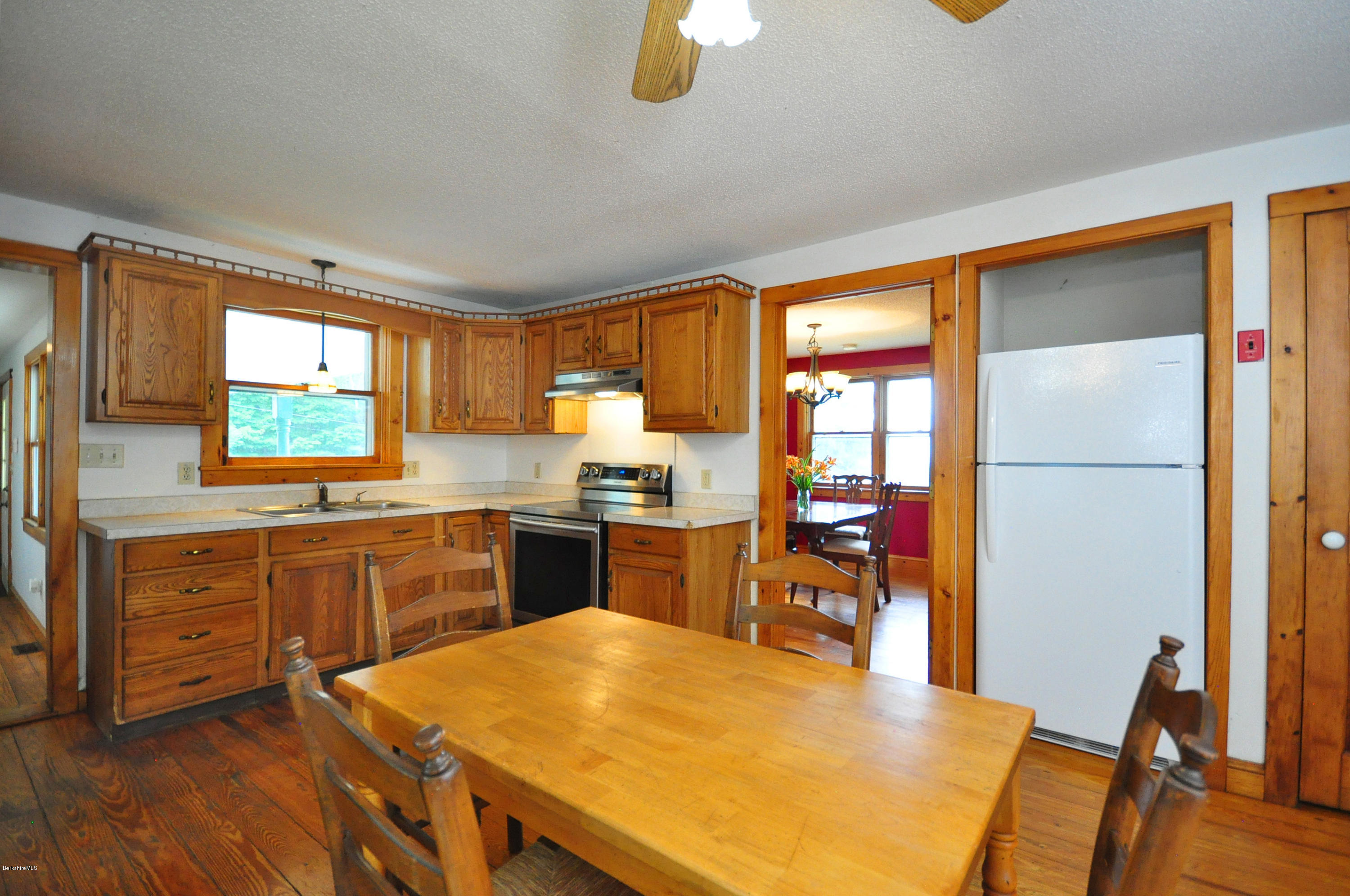 6 Johnnycake Hill Road Chester, MA 01011 - Photo 20 of 43 a kitchen with wooden cabinets and center island