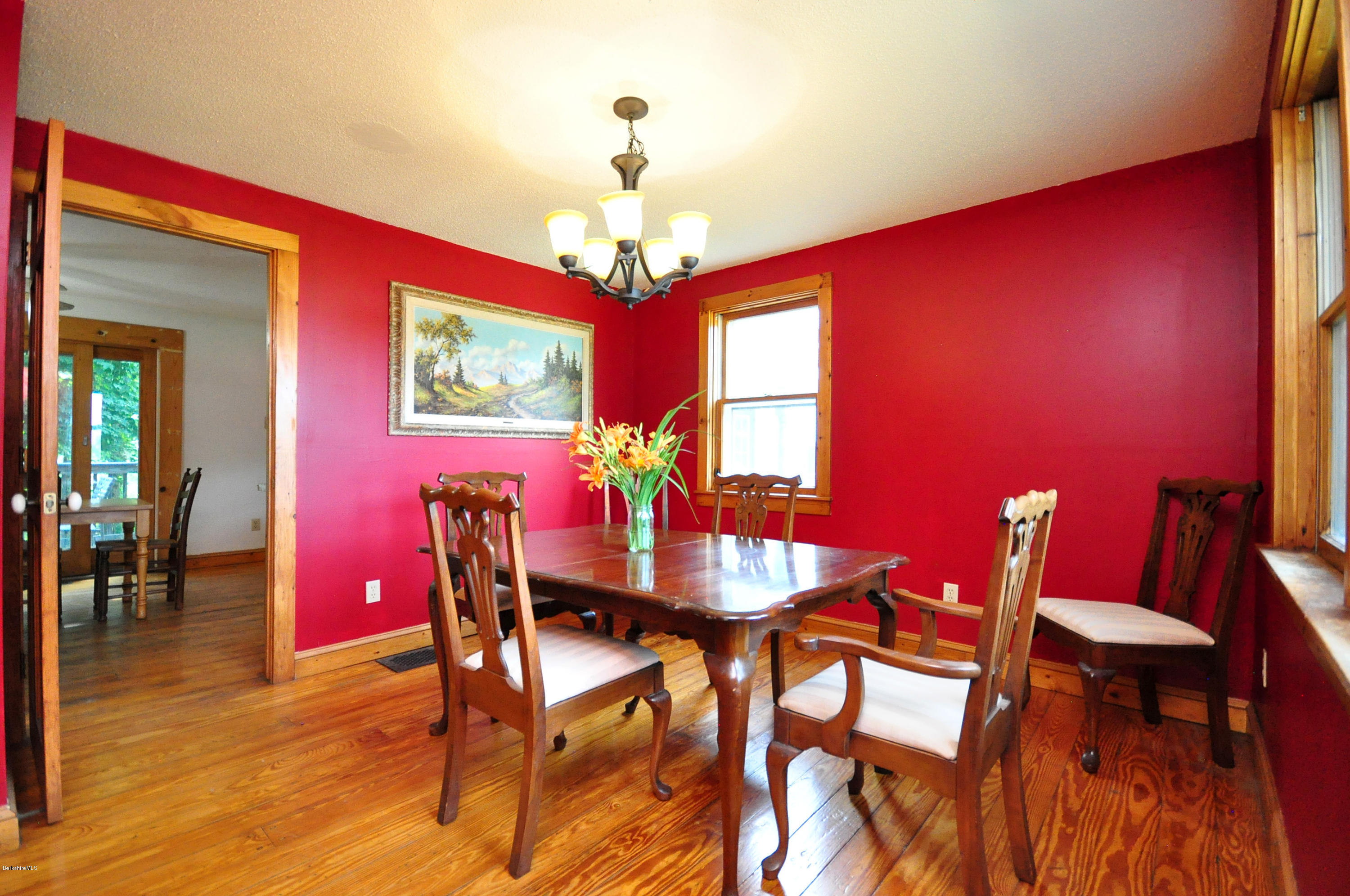 6 Johnnycake Hill Road Chester, MA 01011 - Photo 23 of 43 a view of a dining room with furniture and chandelier