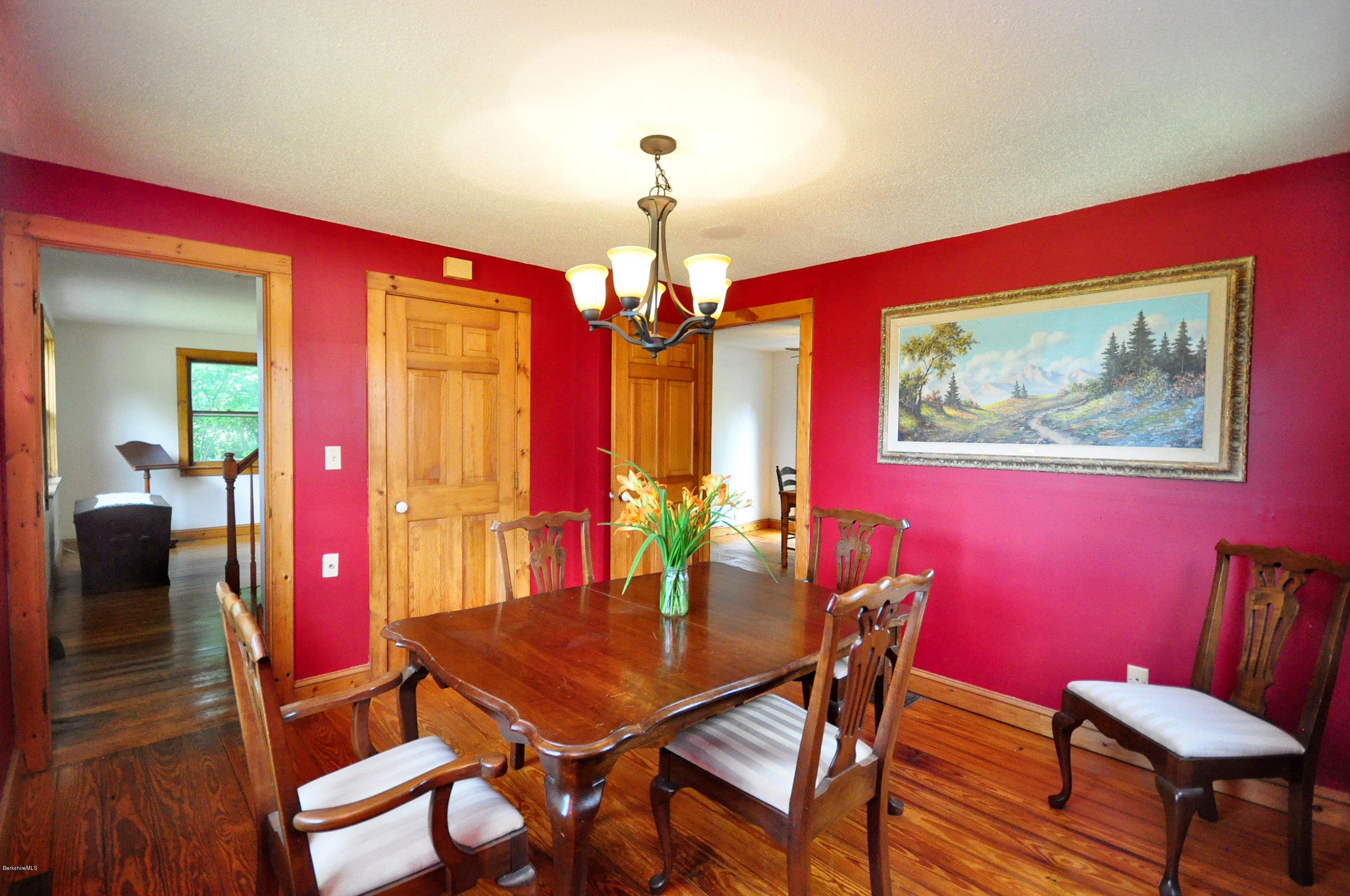 6 Johnnycake Hill Road Chester, MA 01011 - Photo 24 of 43 a view of a dining room with furniture a chandelier and wooden floor