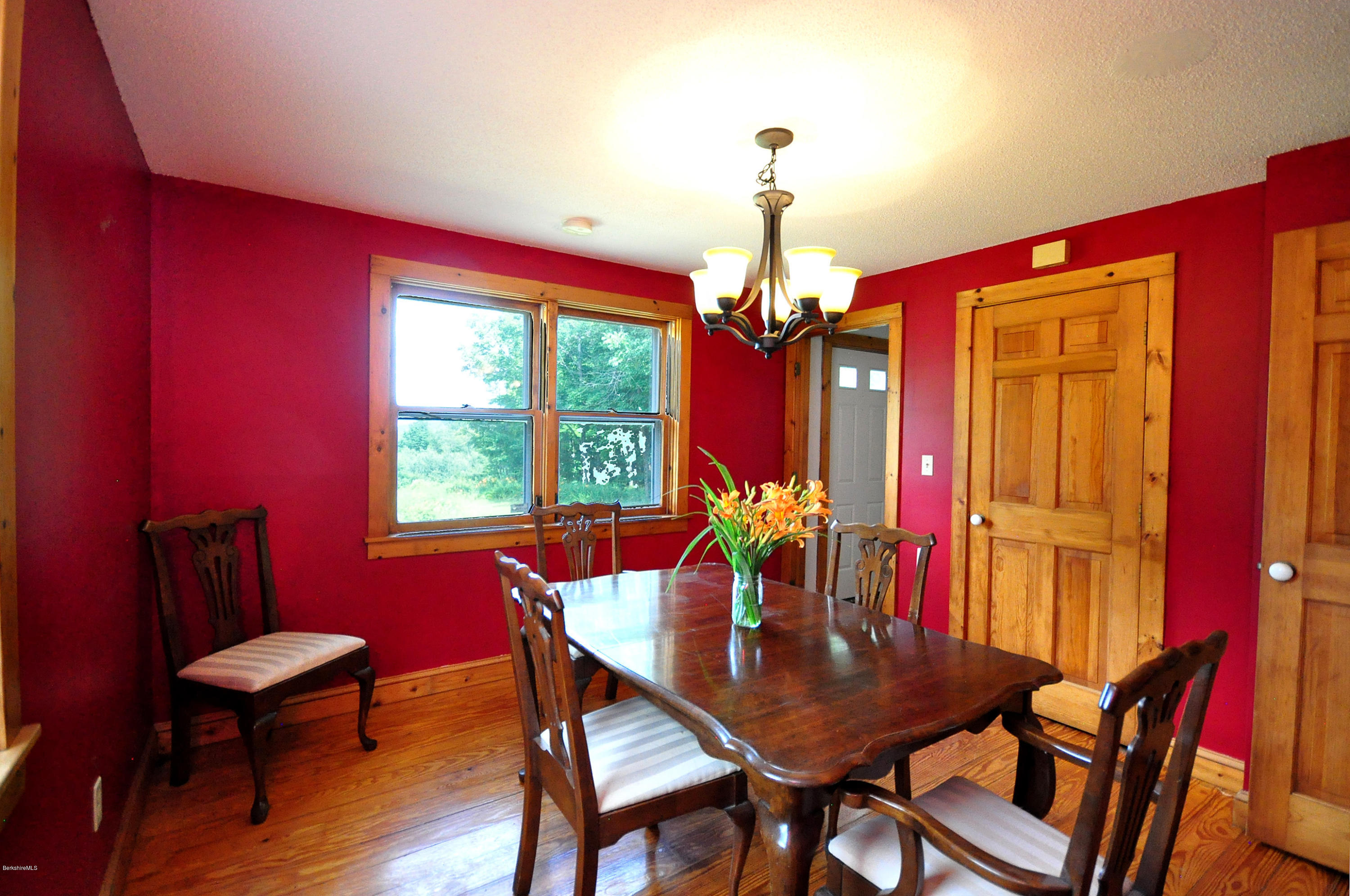 6 Johnnycake Hill Road Chester, MA 01011 - Photo 25 of 43 a view of a dining room with furniture window and wooden floor