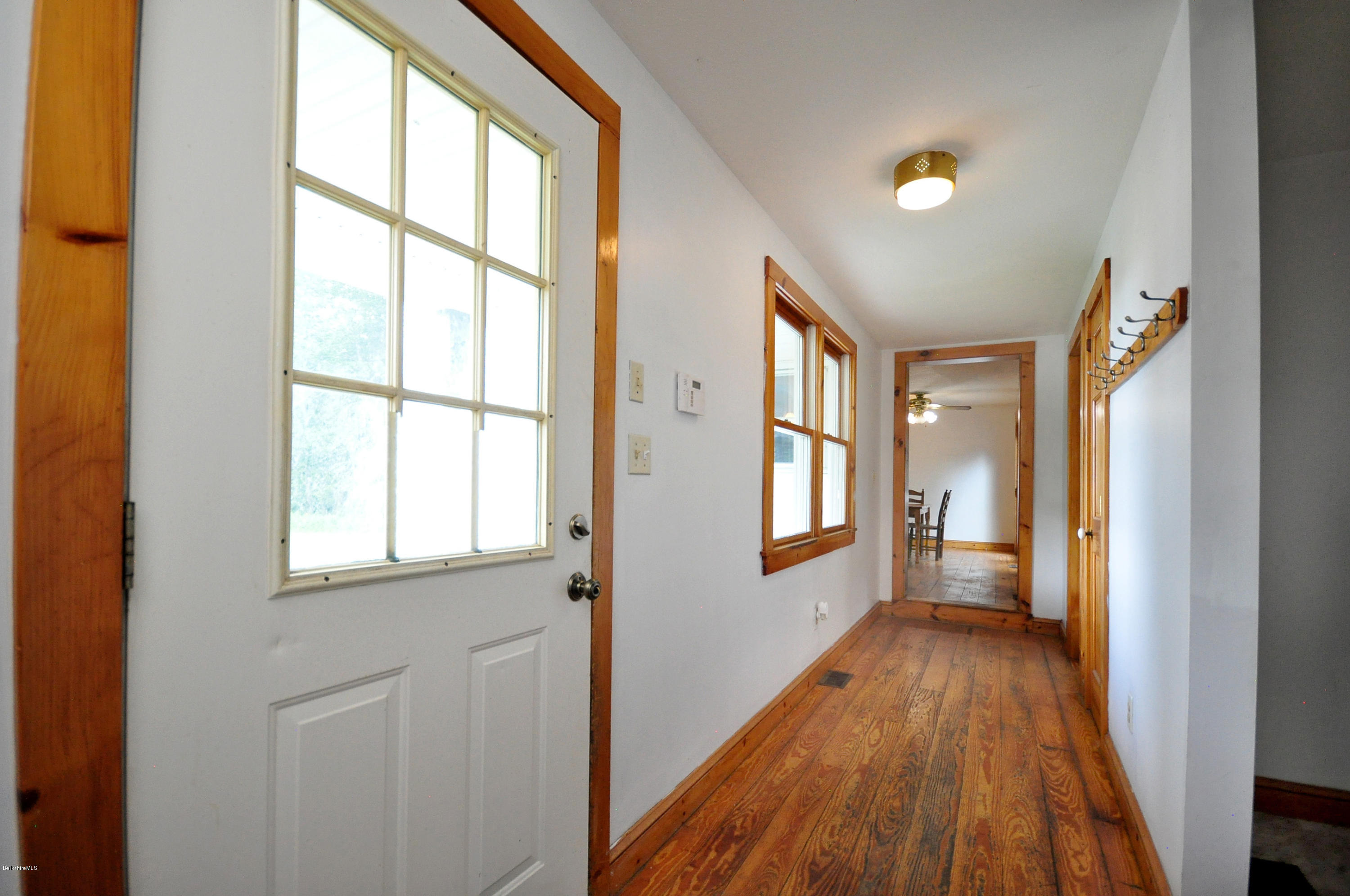 6 Johnnycake Hill Road Chester, MA 01011 - Photo 28 of 43 a view of an empty room with wooden floor and a window