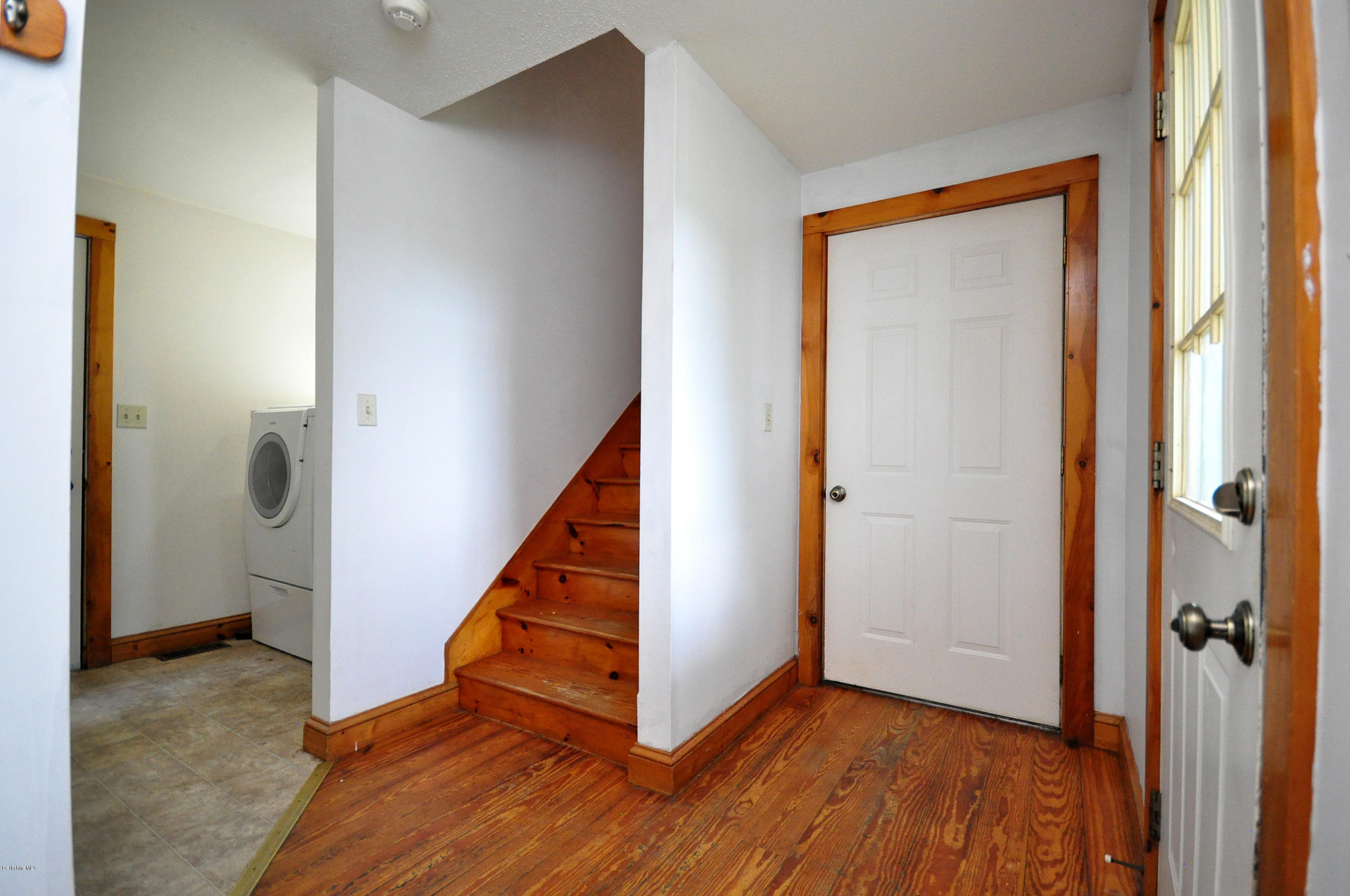 6 Johnnycake Hill Road Chester, MA 01011 - Photo 30 of 43 a view of a hallway with wooden floor and staircase