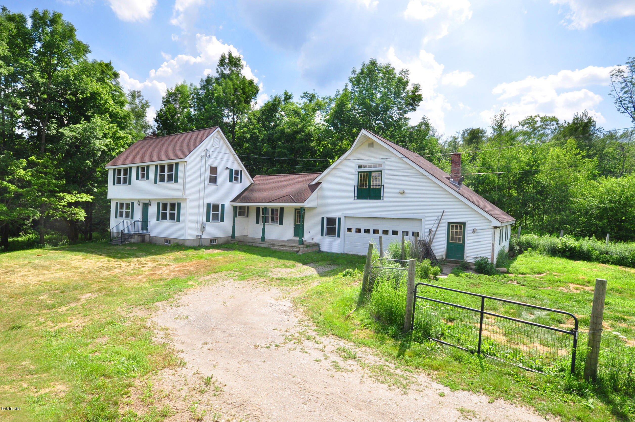 6 Johnnycake Hill Road Chester, MA 01011 - Photo 4 of 43 a view of a house with a big yard and potted plants