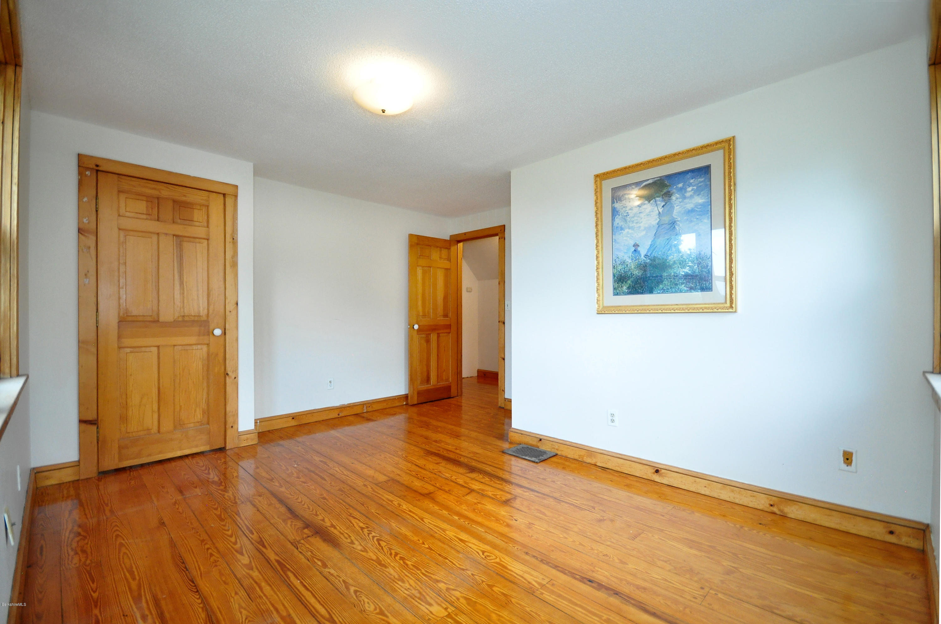 6 Johnnycake Hill Road Chester, MA 01011 - Photo 38 of 43 a view of an empty room with wooden floor and a window