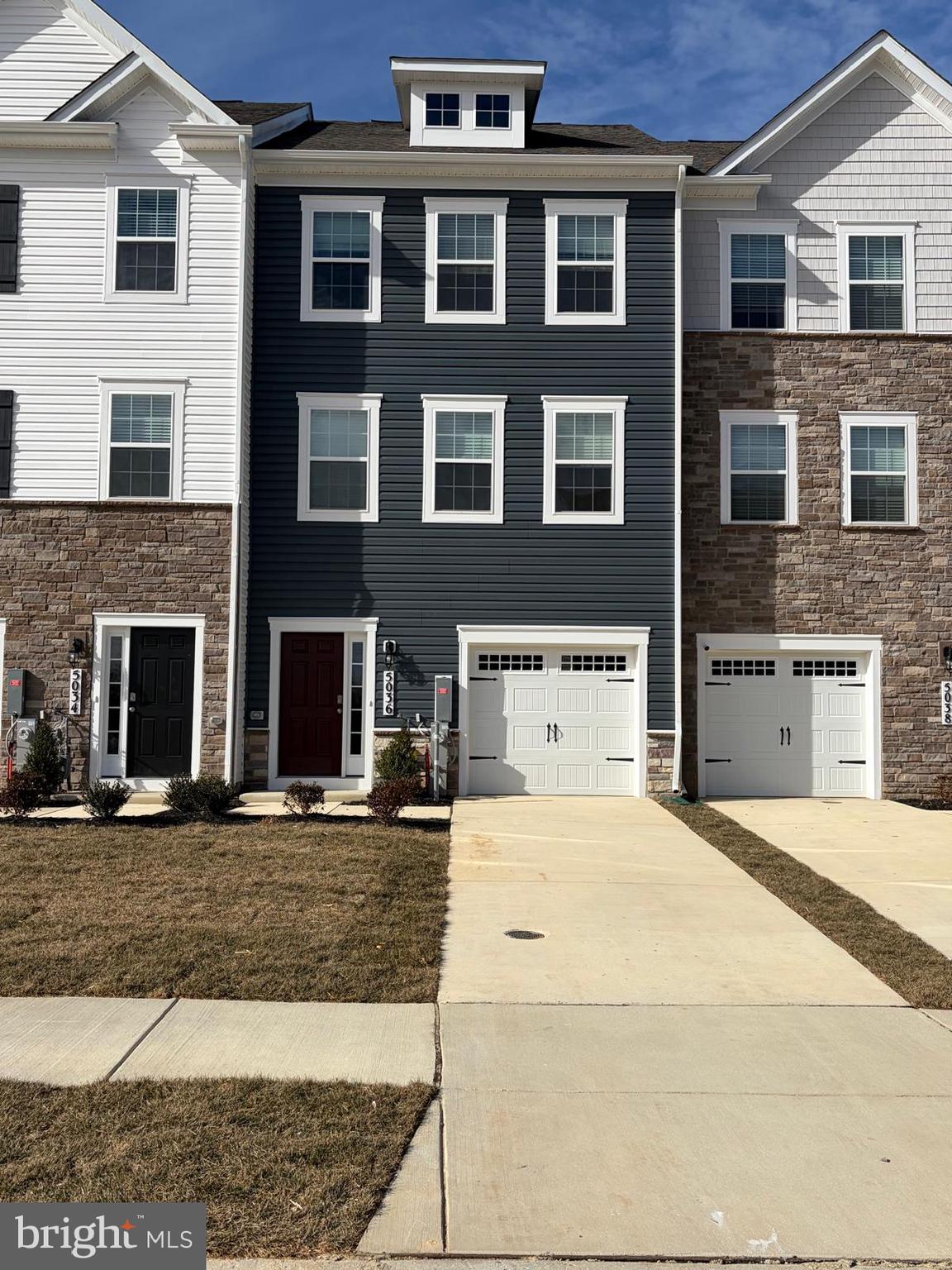 5036 Silver Oak Drive Baltimore, MD 21237 - Photo 2 of 7 a view of a brick building with many windows