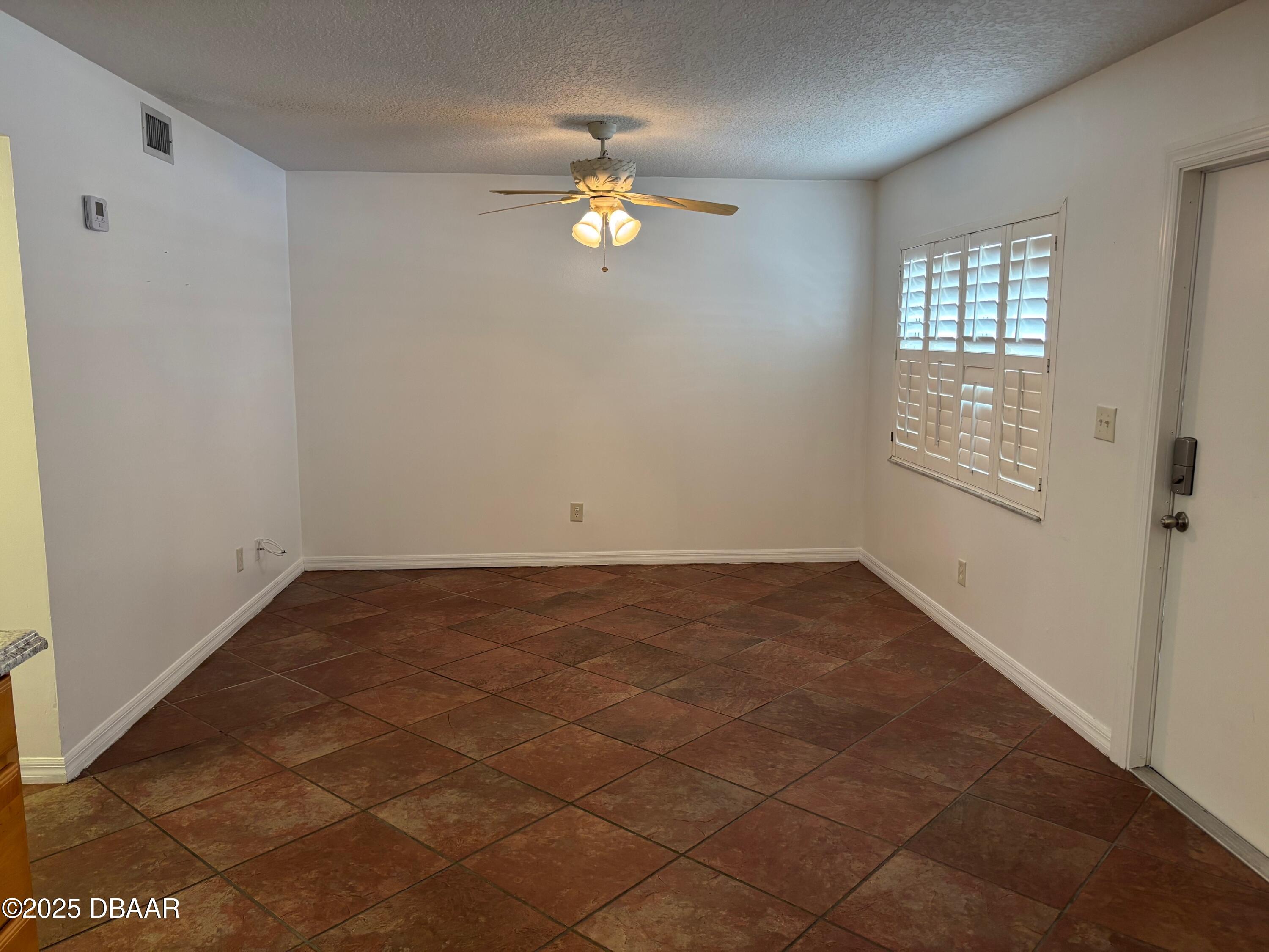 3724 South Atlantic Avenue, Unit 4 Daytona Beach, FL 32118 - Photo 3 of 10 a view of empty room with window