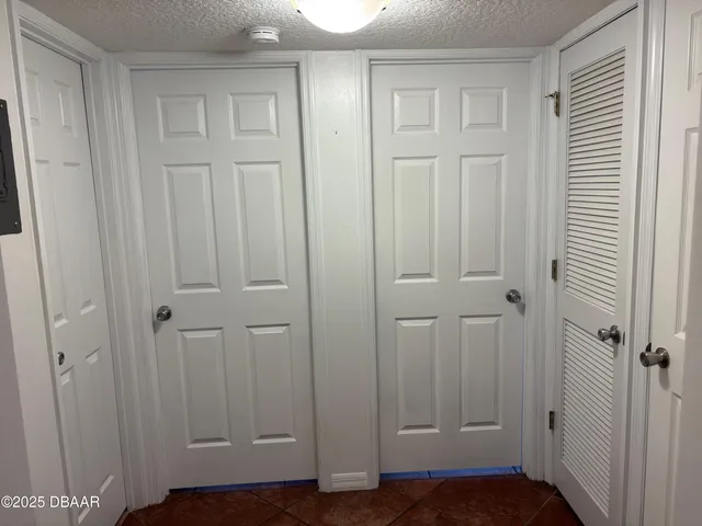 an empty room with wooden floor