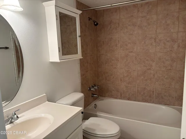 a bathroom with a sink toilet and bathtub