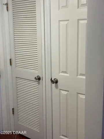 a view of a bathroom with a white door