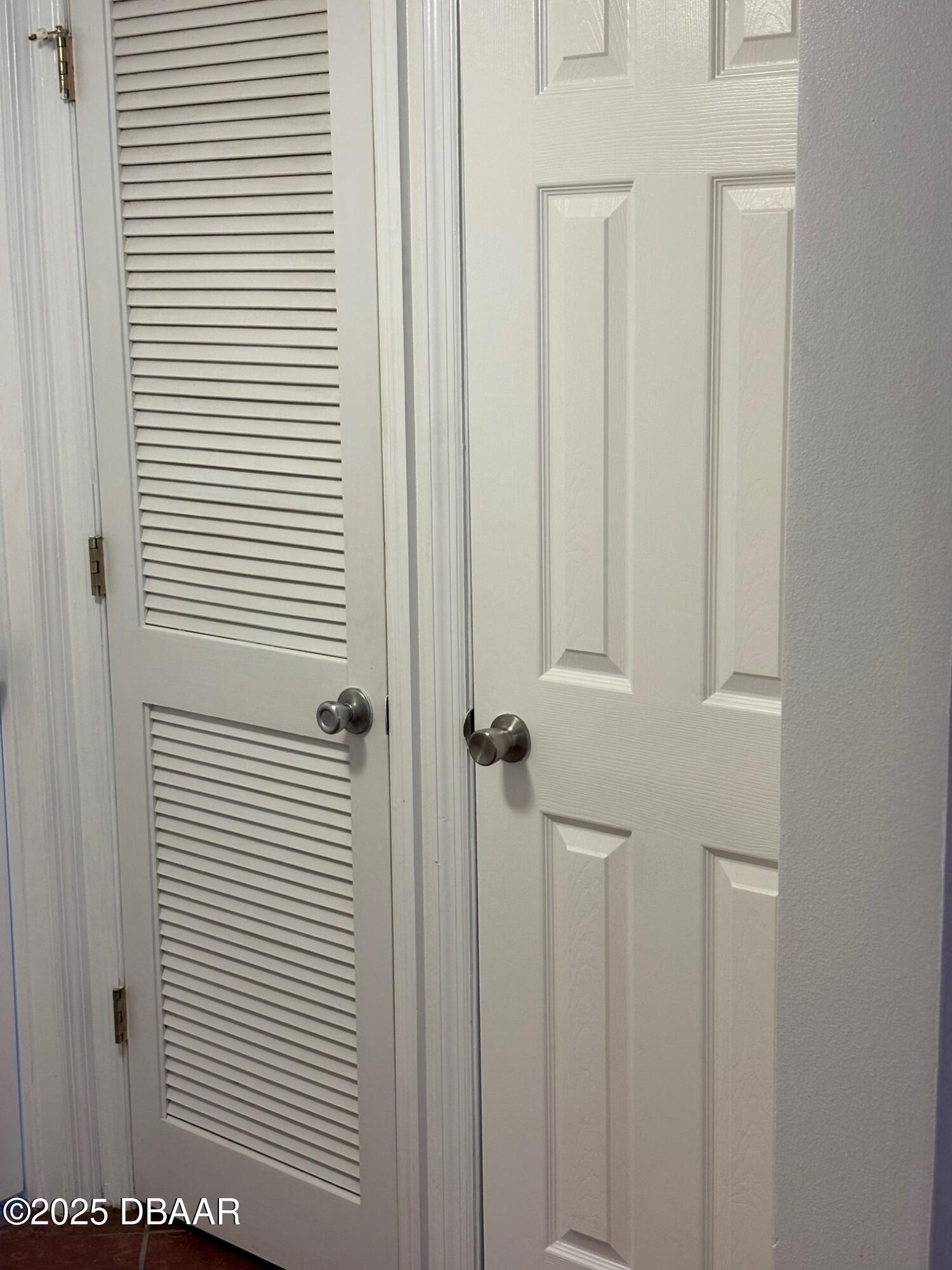 3724 South Atlantic Avenue, Unit 4 Daytona Beach, FL 32118 - Photo 10 of 10 a view of a bathroom with a white door