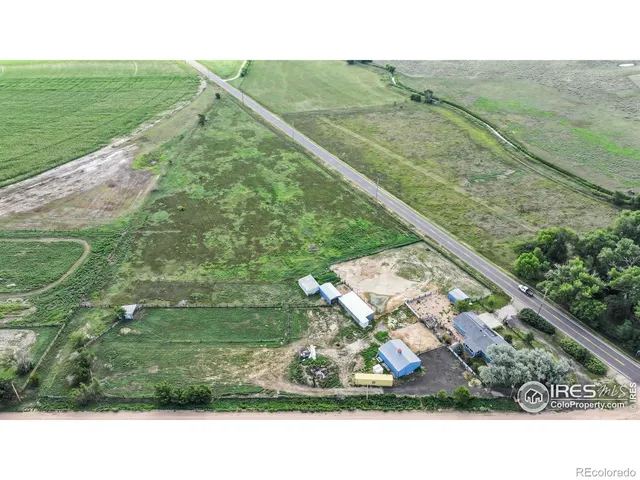 a view of a field with an ocean view