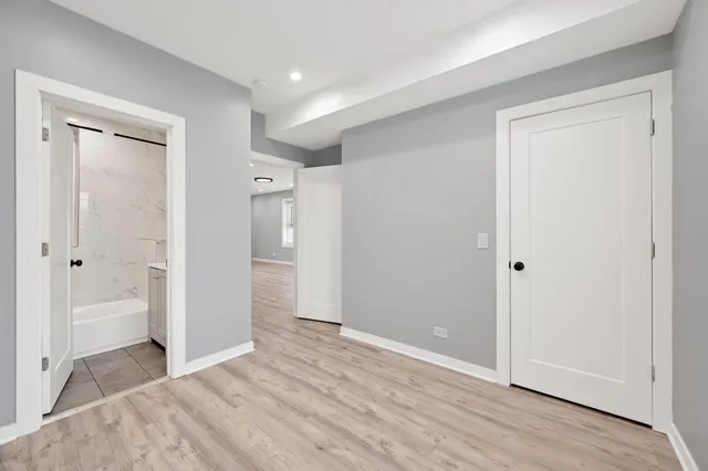 a view of a bathroom with toilet shower and windows