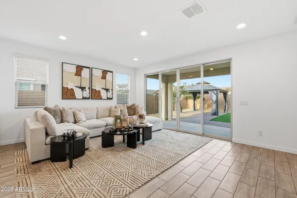 a living room with furniture and a large window