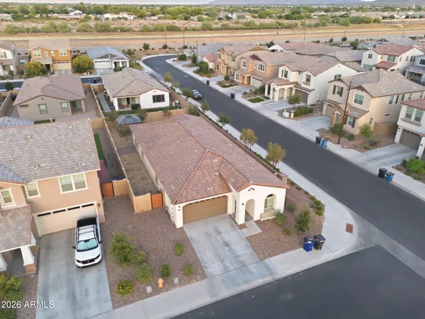 an aerial view of residential houses with outdoor space