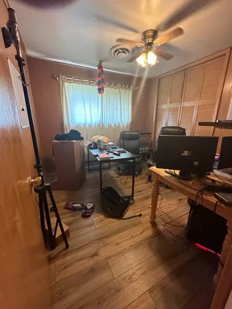 a workspace with furniture and window