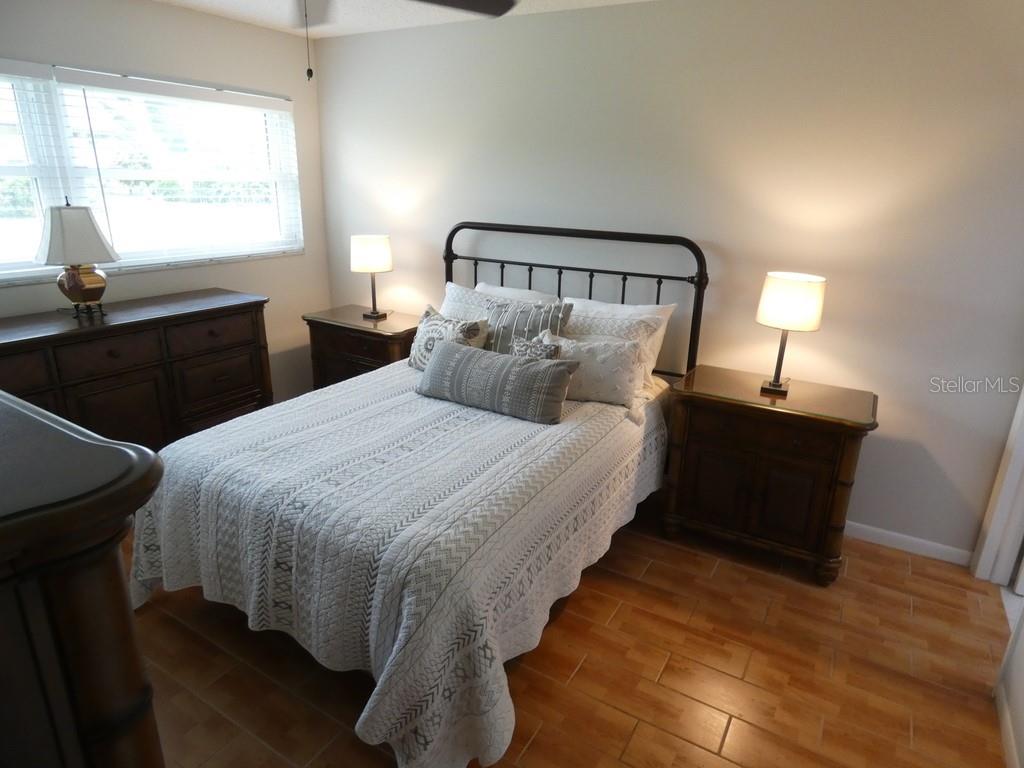 1701 Pinehurst Road, Unit 9G Dunedin, FL 34698 - Photo 4 of 22 a bedroom with a bed and window