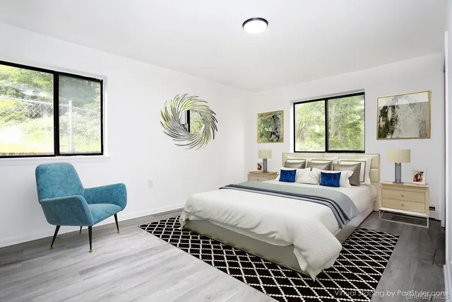 a bedroom with a bed and a chair