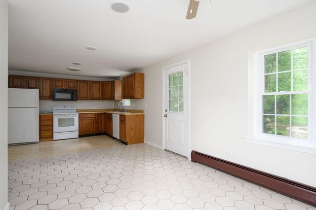 a view of a kitchen with a sink