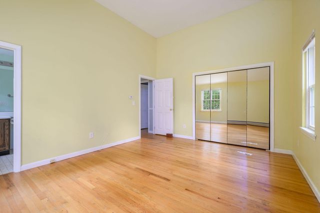 a view of an empty room with glass door