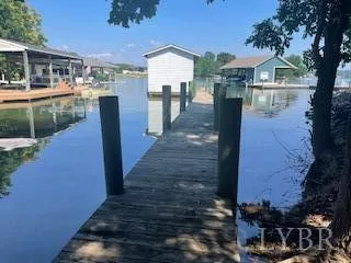 a front view of a house with a yard and balcony