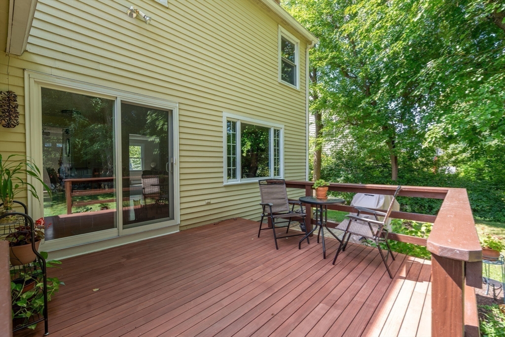 27 Prospect Avenue Arlington, MA 02476 - Photo 12 of 42 a view of a patio with table and chairs with wooden floor and fence