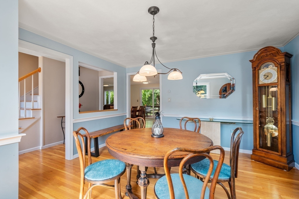 27 Prospect Avenue Arlington, MA 02476 - Photo 13 of 42 a view of a dining room with furniture and wooden floor