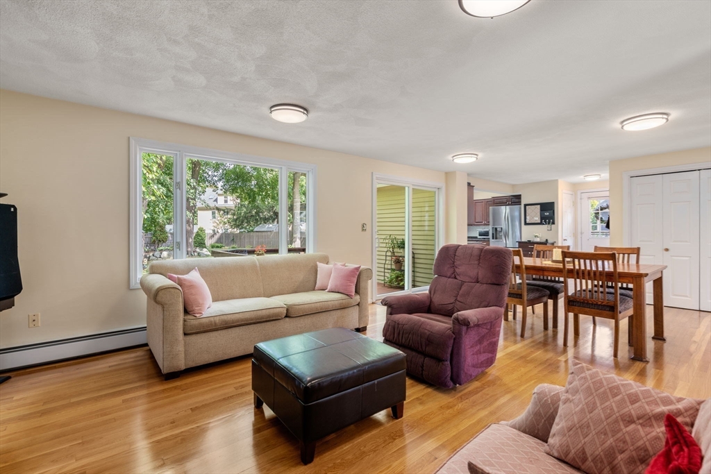 27 Prospect Avenue Arlington, MA 02476 - Photo 16 of 42 a living room with furniture and large windows
