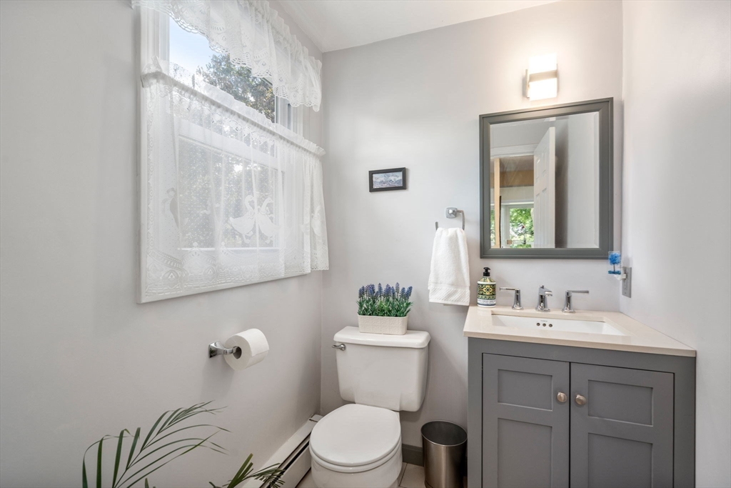 27 Prospect Avenue Arlington, MA 02476 - Photo 23 of 42 a bathroom with a toilet a sink and mirror