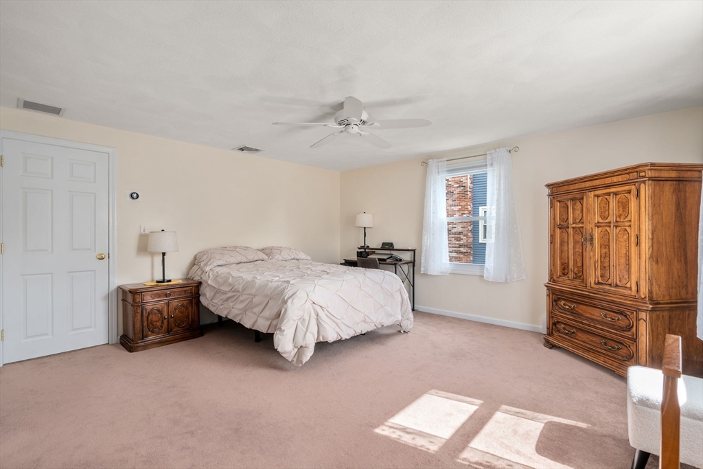 27 Prospect Avenue Arlington, MA 02476 - Photo 28 of 42 a spacious bedroom with a bed dresser and a window