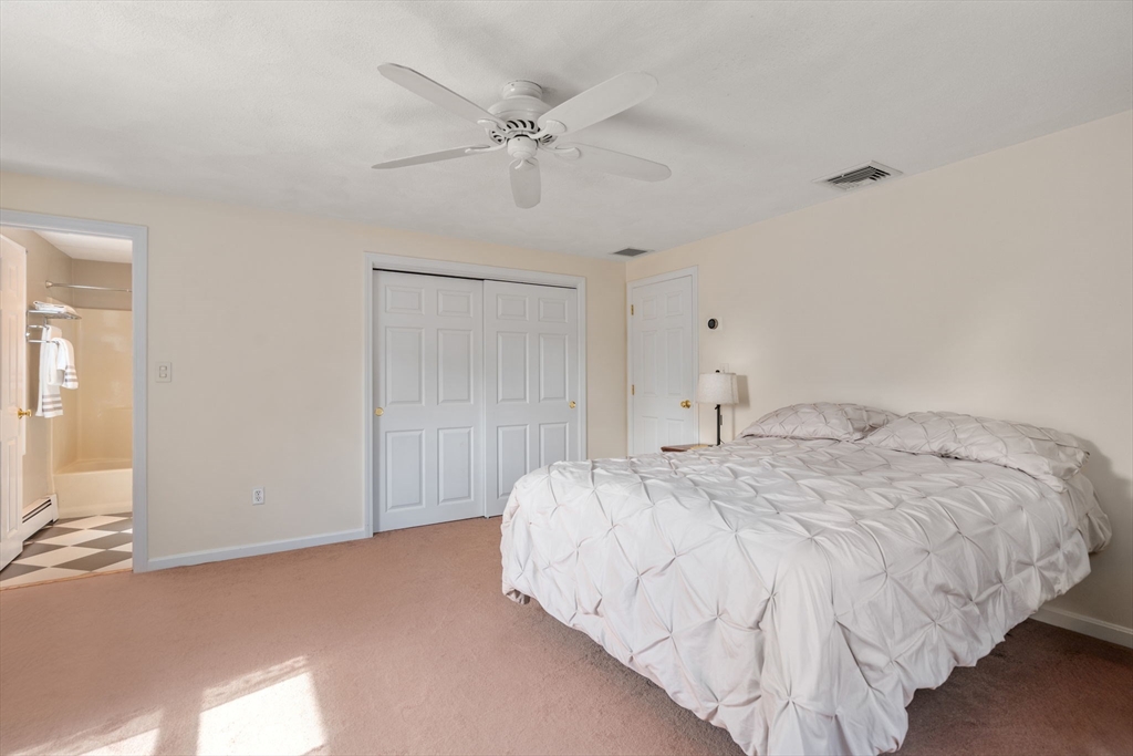 27 Prospect Avenue Arlington, MA 02476 - Photo 29 of 42 a bedroom with a bed and a chandelier
