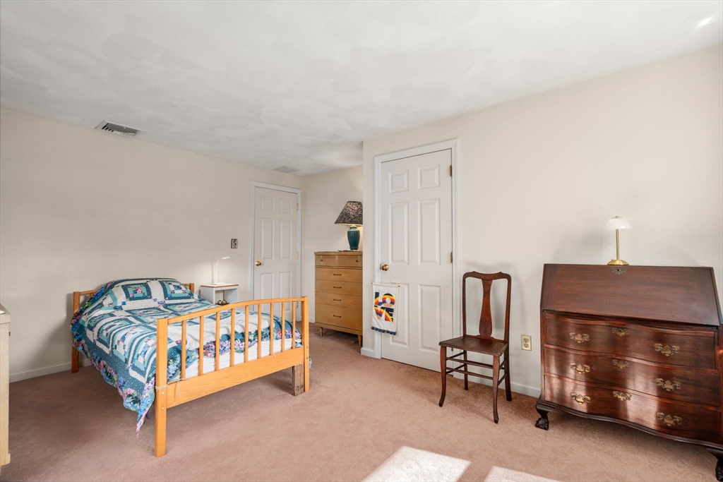 27 Prospect Avenue Arlington, MA 02476 - Photo 32 of 42 a bedroom with a bed and a night stand