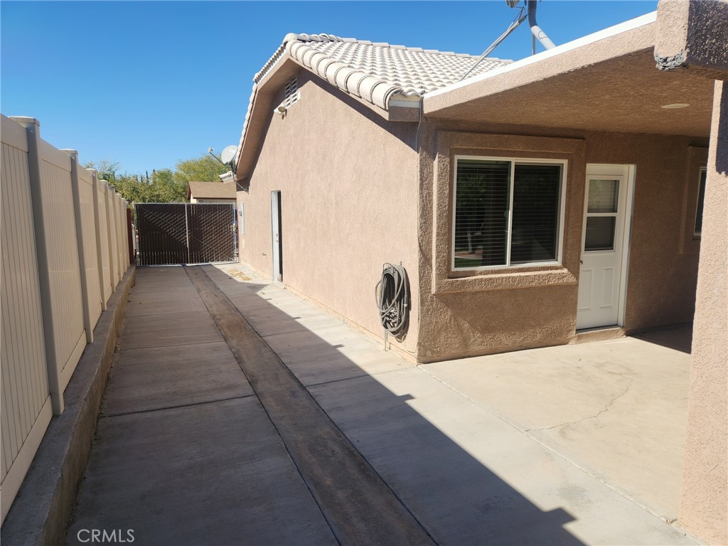13237 Heritage Drive Victorville, CA 92392 - Photo 17 of 21 a view of a house with a backyard