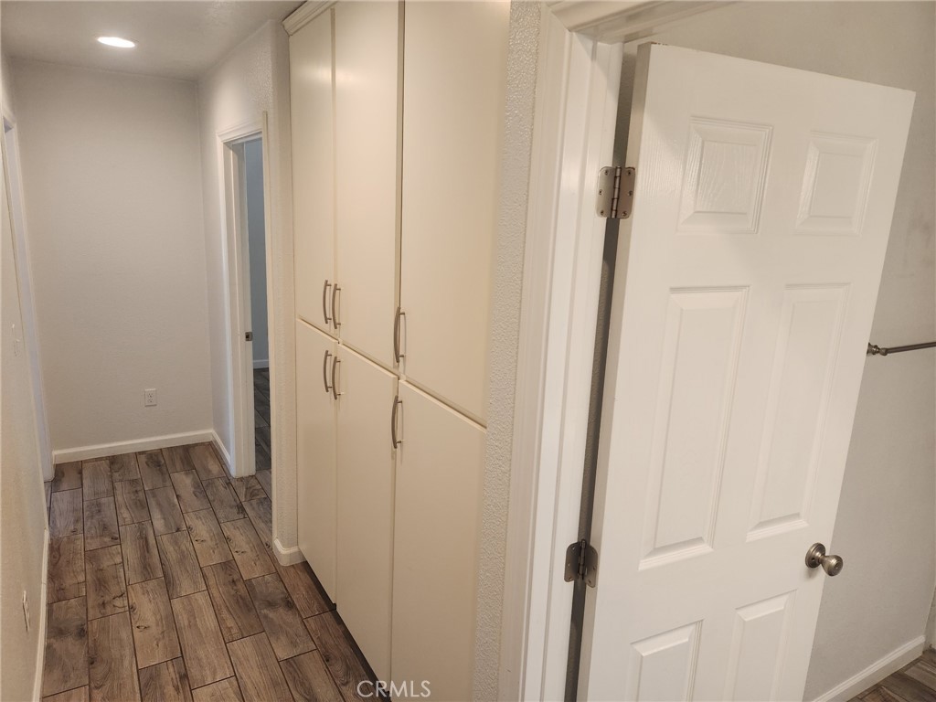 13237 Heritage Drive Victorville, CA 92392 - Photo 10 of 21 a view of a hallway with wooden floor and entryway