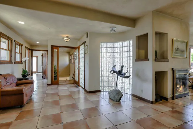 a view of a livingroom with furniture and windows