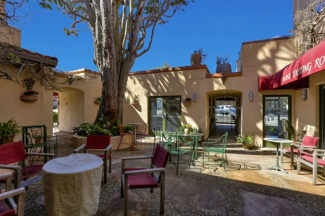 a view of a cafe with sitting area