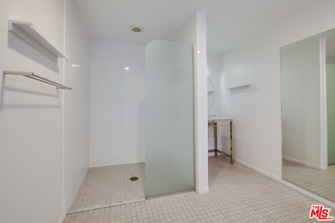 700 Main Street, Unit 5 Venice, CA 90291 - Photo 11 of 28 a bathroom with a bathtub and a shower